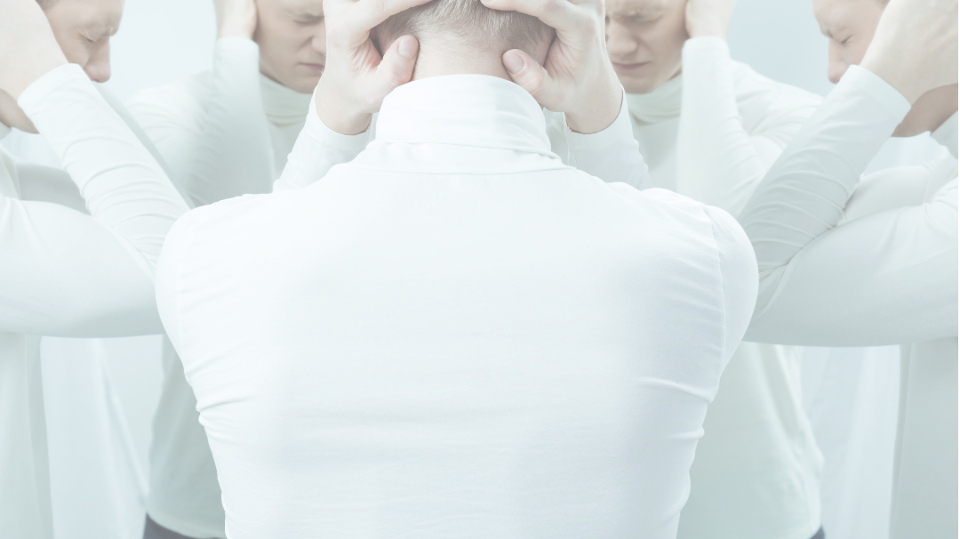 man in a white shirt depicting stress and suicide