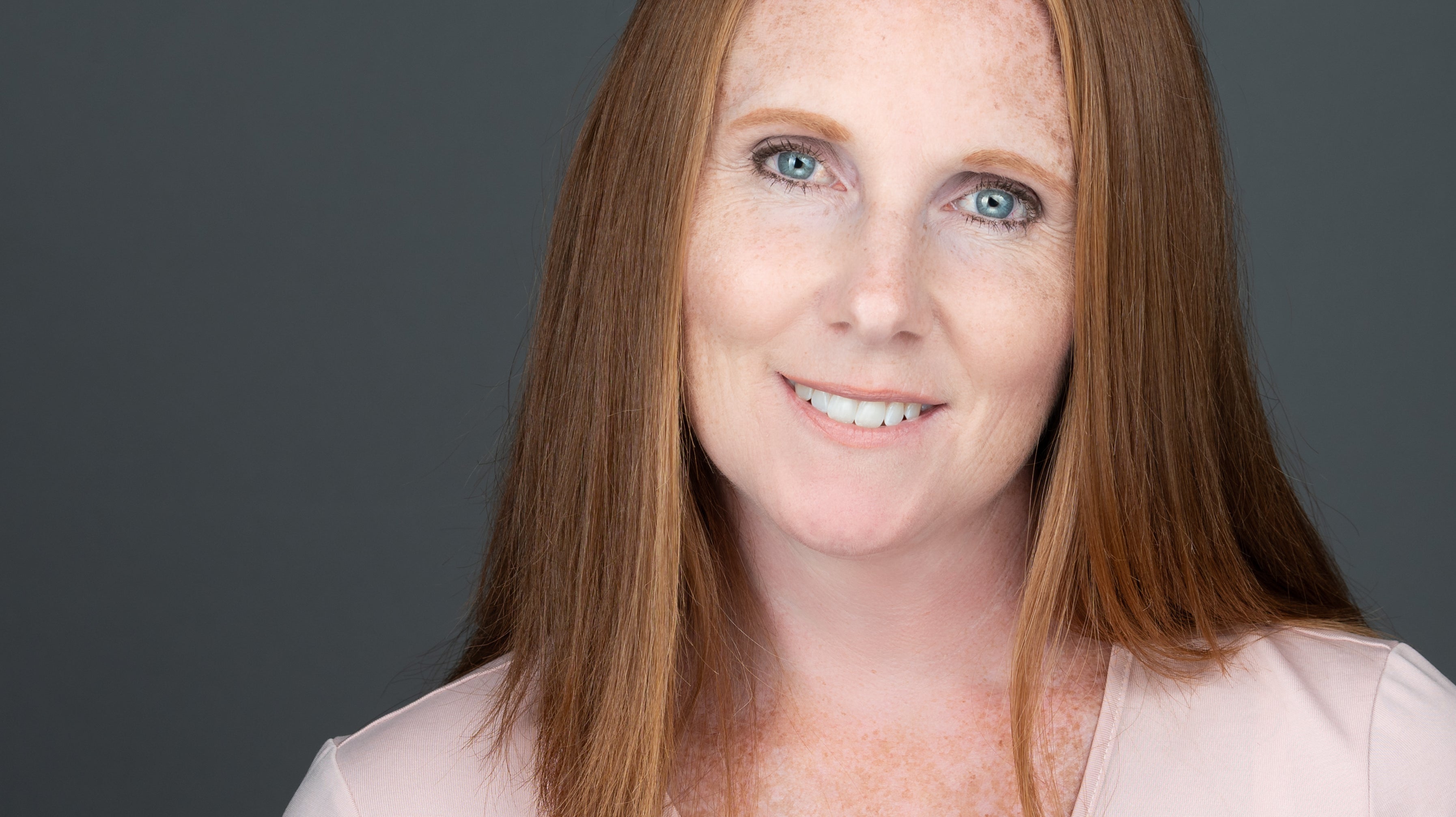 Should you smile in a headshot?