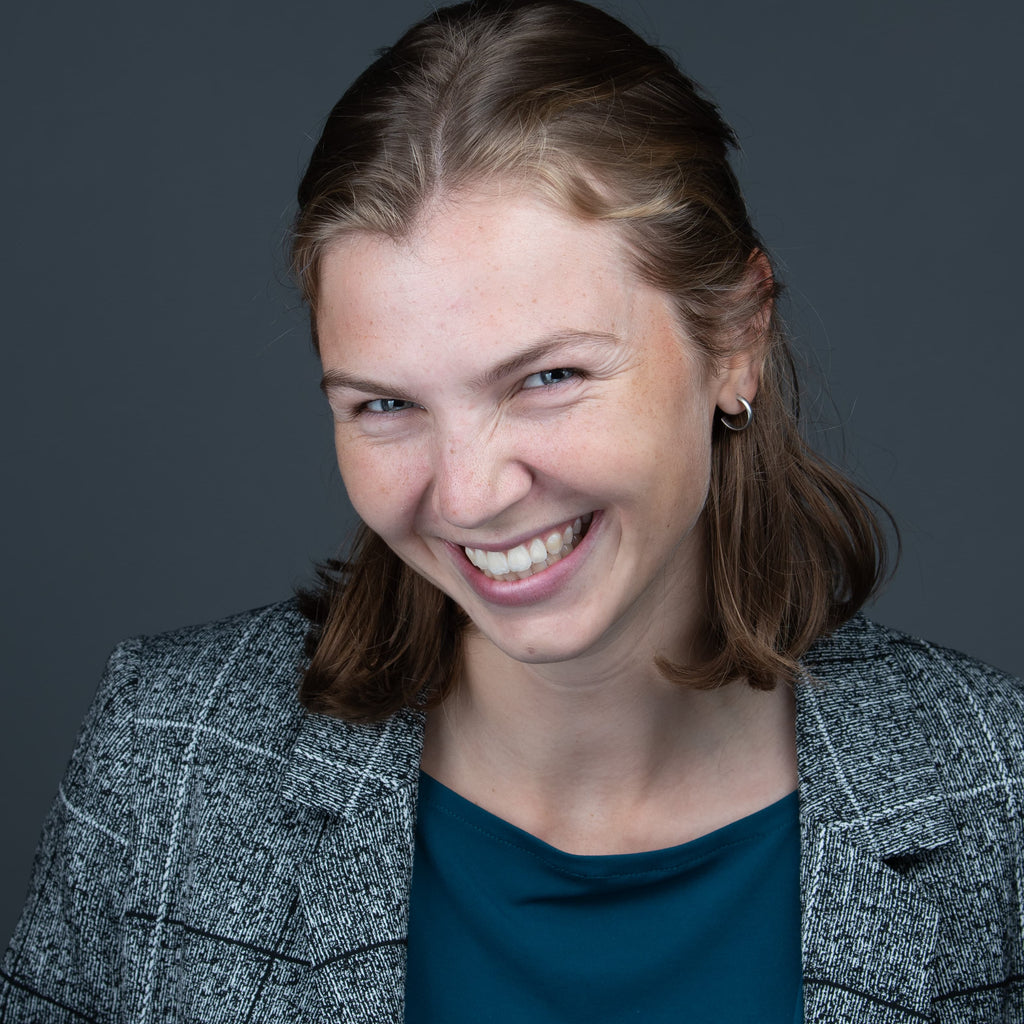 professional headshot of young women who is laughing